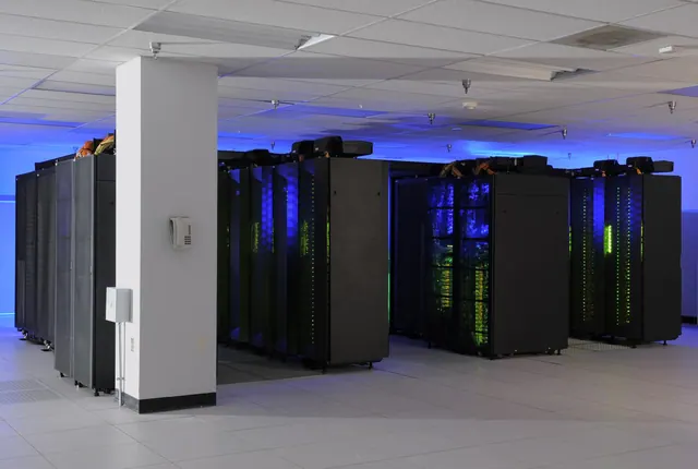 supercomputer cluster of compute racks in a NASA machine room