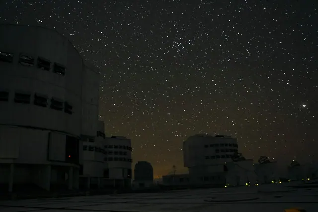 telescope domes of a large observatory at night